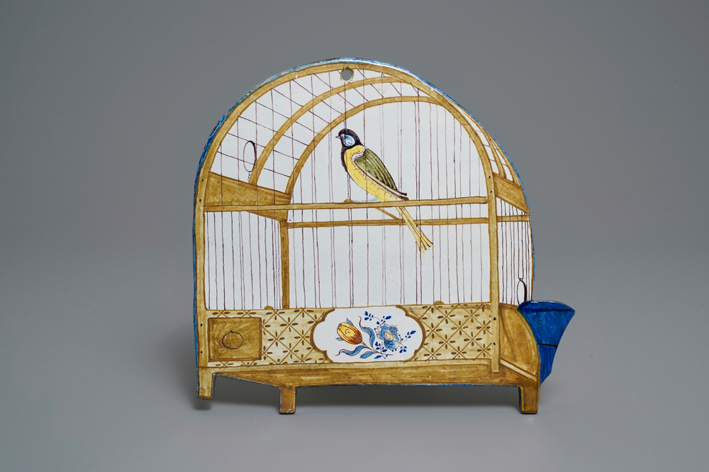 A polychrome Dutch Delft trompe l'oeil birdcage plaque, 18th C.